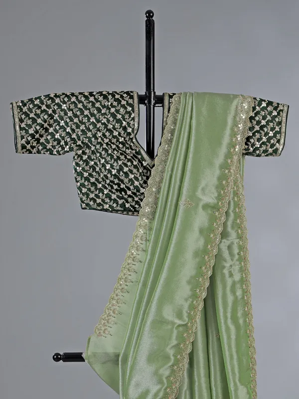 Pista green tissue silk saree with festive sparkle