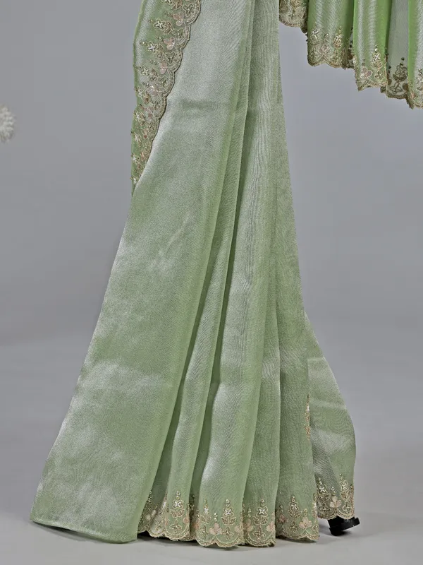 Pista green tissue silk saree with festive sparkle