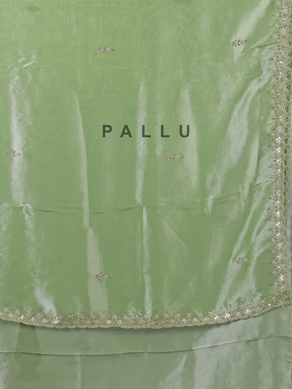 Pista green tissue silk saree with festive sparkle