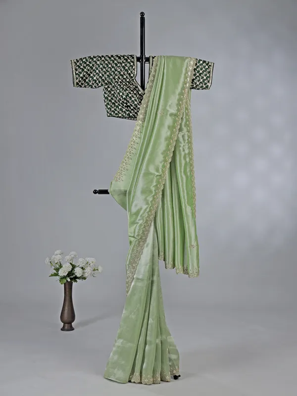 Pista green tissue silk saree with festive sparkle