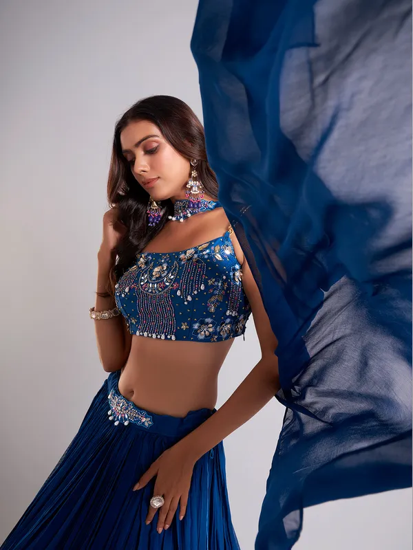 Pretty teal blue lahenga choli in georgette