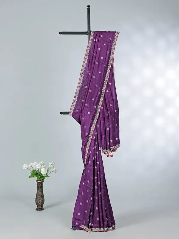 Purple dola silk saree with bold pink blouse