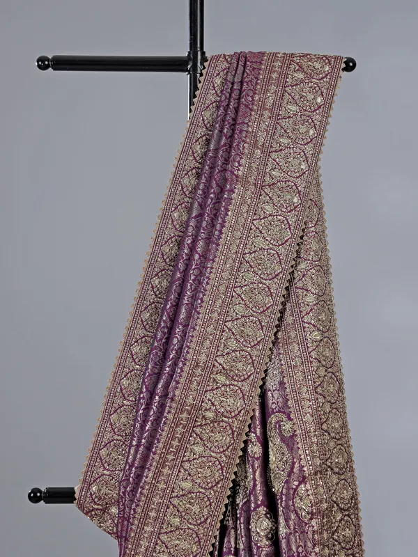 Purple kanjivaram silk saree with royal embellishments