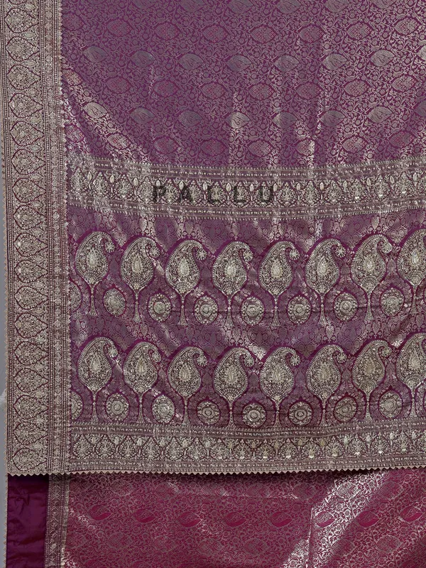 Purple kanjivaram silk saree with royal embellishments