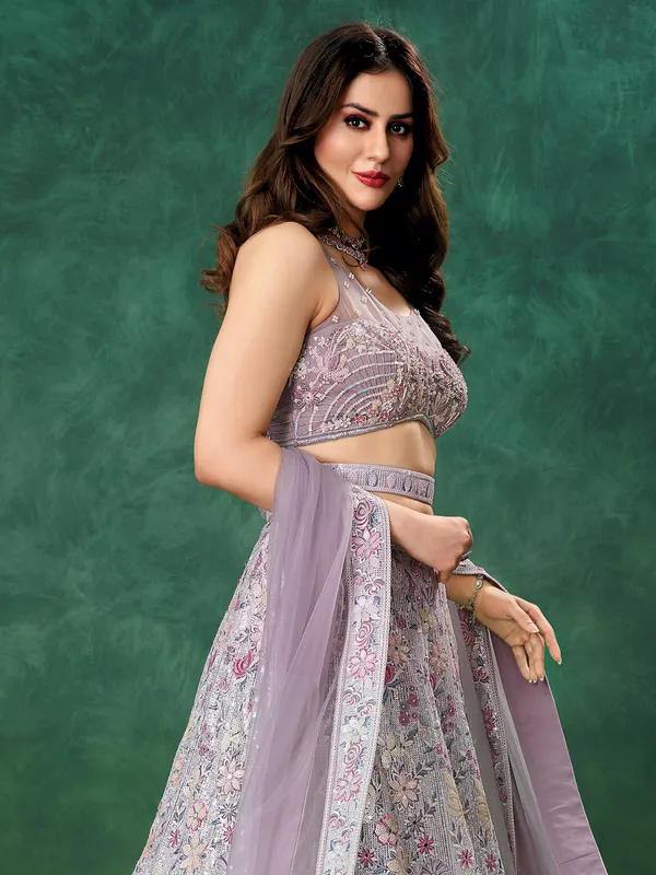 Purple net reception wear lehenga choli