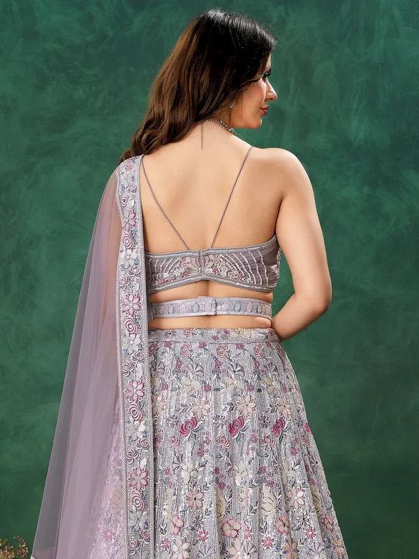 Purple net reception wear lehenga choli
