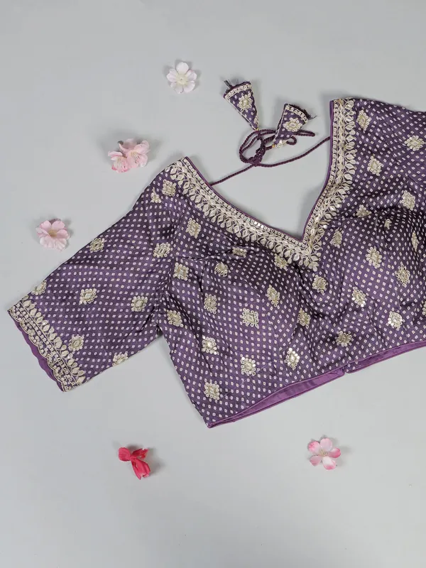 Purple printed silk saree with V neck blouse