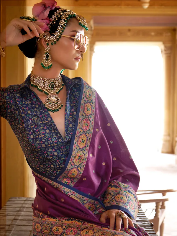 Purple silk saree featuring ethnic prints and blouse