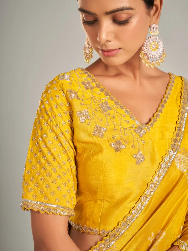 Radiant mustard yellow silk saree with zari work