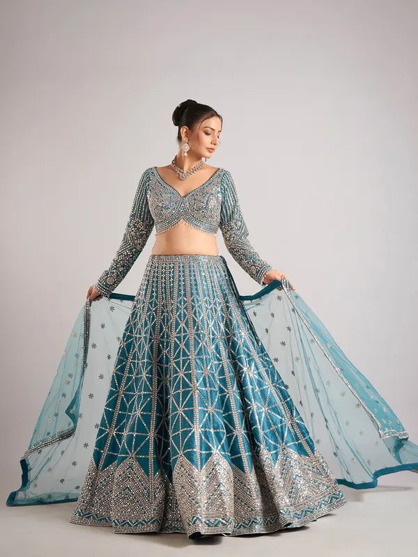Rama green raw silk lehenga choli with mirror detailing
