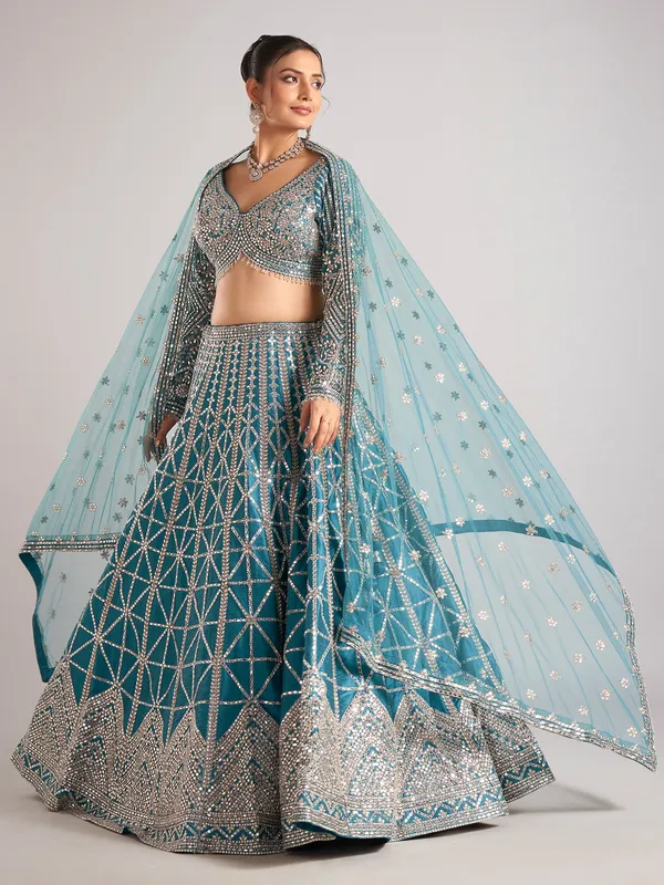 Rama green raw silk lehenga choli with mirror detailing