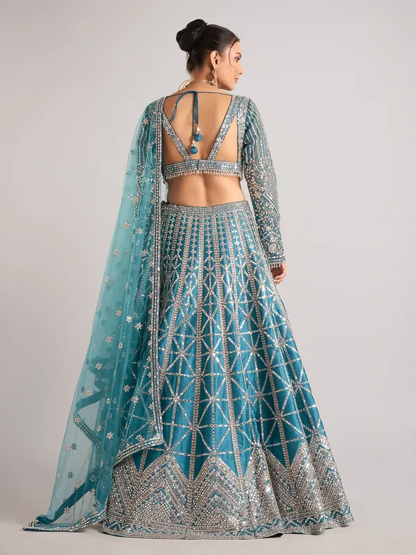 Rama green raw silk lehenga choli with mirror detailing