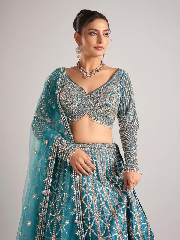 Rama green raw silk lehenga choli with mirror detailing
