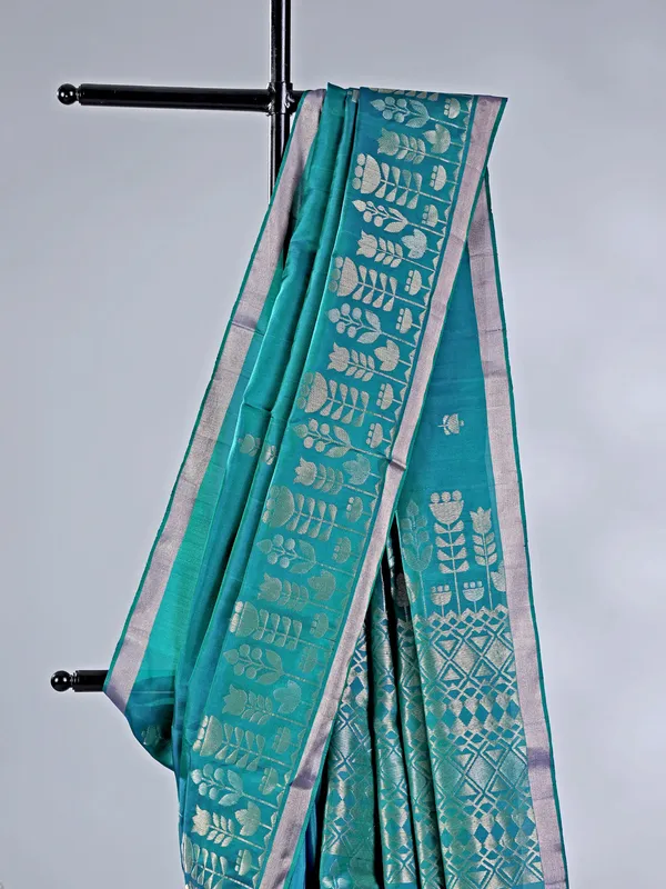 Rama green silk saree with rich zari embellishment