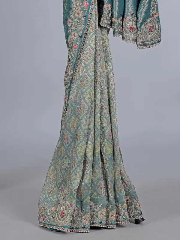 Rama green tissue silk festive wear saree with beads detailing