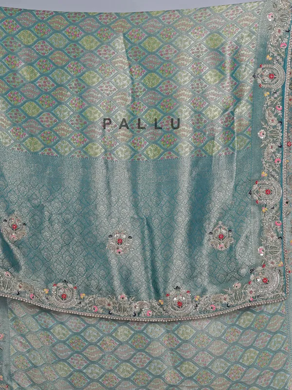 Rama green tissue silk festive wear saree with beads detailing