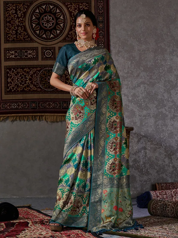 Rama green zari woven minakari saree