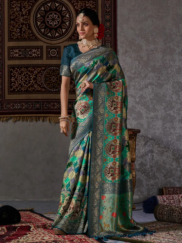 Rama green zari woven minakari saree