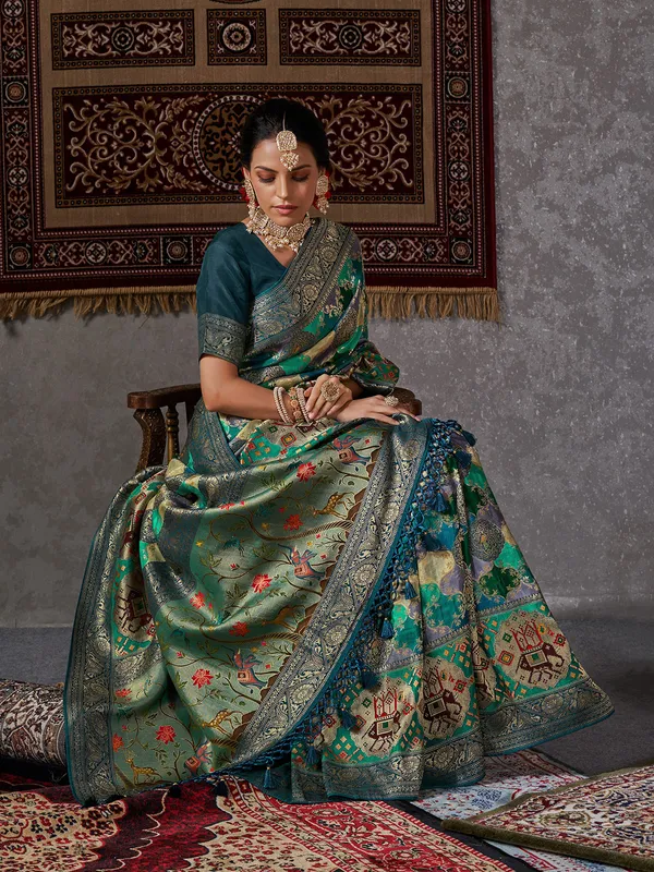 Rama green zari woven minakari saree