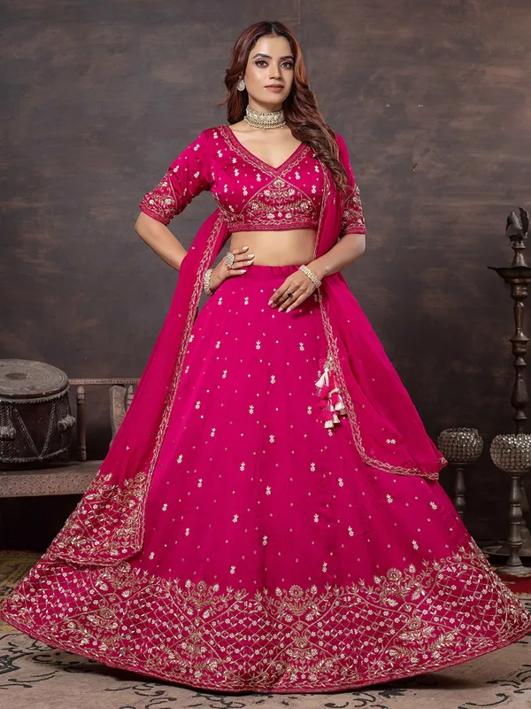 Rani color lehenga choli with elegant craftsmanship