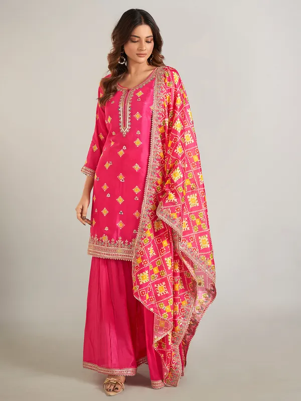Rani color printed silk sharara suit with dupatta