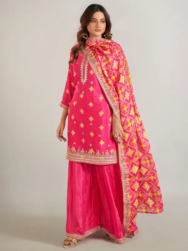 Rani color printed silk sharara suit with dupatta