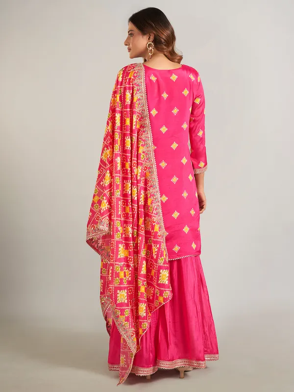 Rani color printed silk sharara suit with dupatta