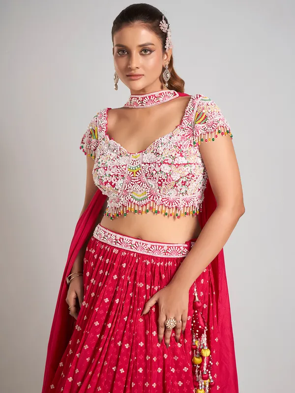 Rani color silk pearl embellished lehenga choli