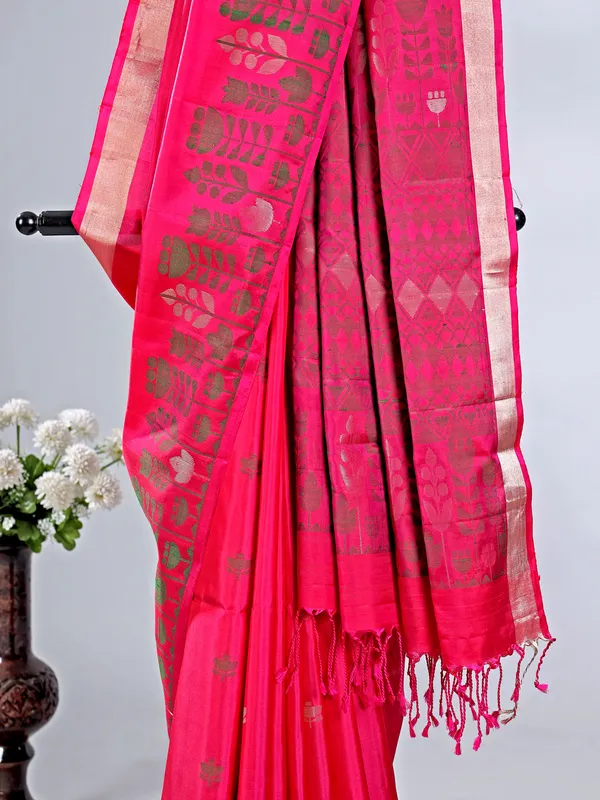 Rani color silk saree with zari highlights