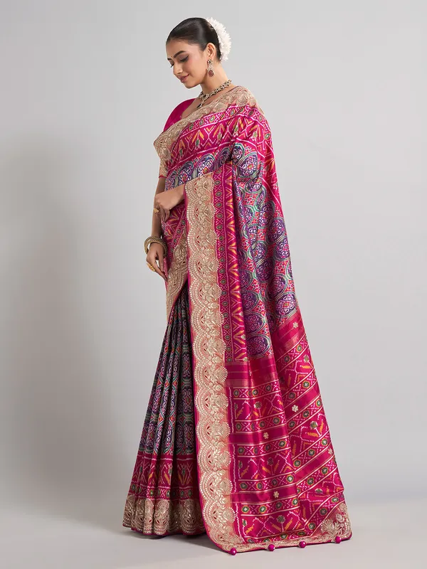 Rani pink and purple patola silk saree for wedding occasions