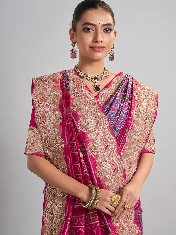 Rani pink and purple patola silk saree for wedding occasions