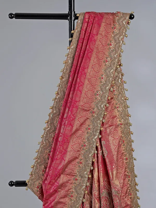 Rani pink kanjivaram silk unstitched saree with opulent detailing