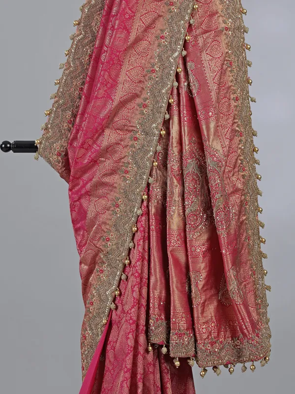 Rani pink kanjivaram silk unstitched saree with opulent detailing