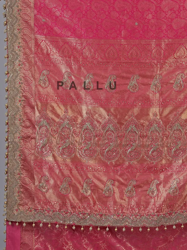 Rani pink kanjivaram silk unstitched saree with opulent detailing