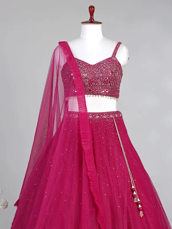 Rani pink net lehenga choli with diamond accents