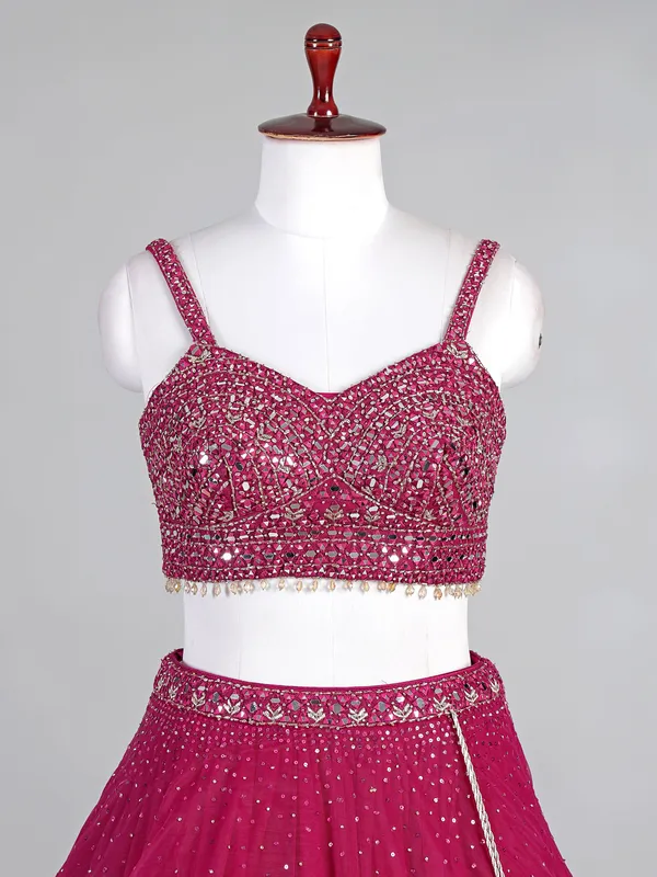 Rani pink net lehenga choli with diamond accents