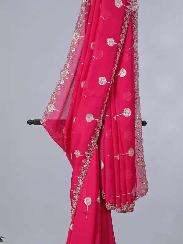 Rani pink organza saree with zari detailing