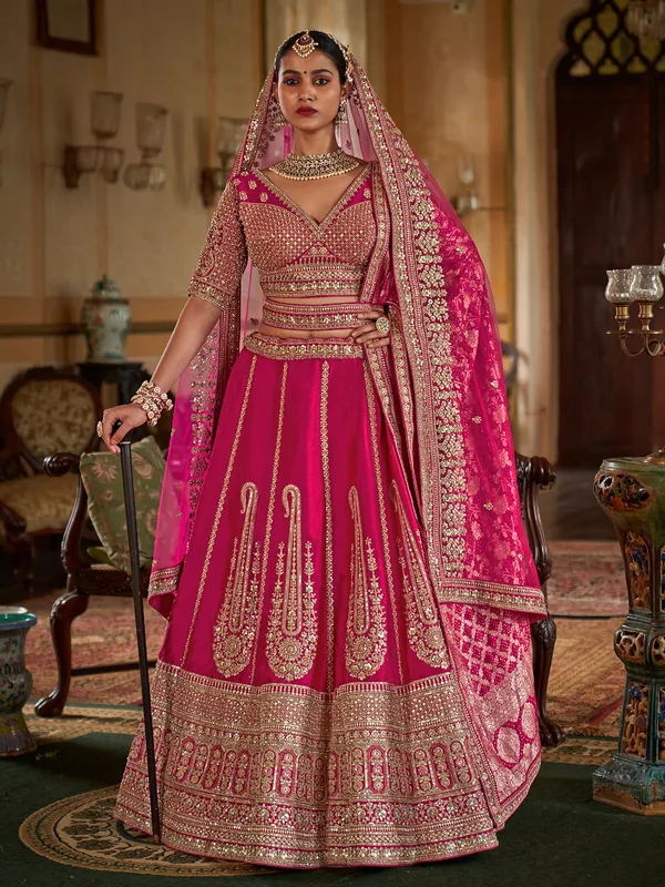 Rani pink silk bridal lehenga choli with beads work