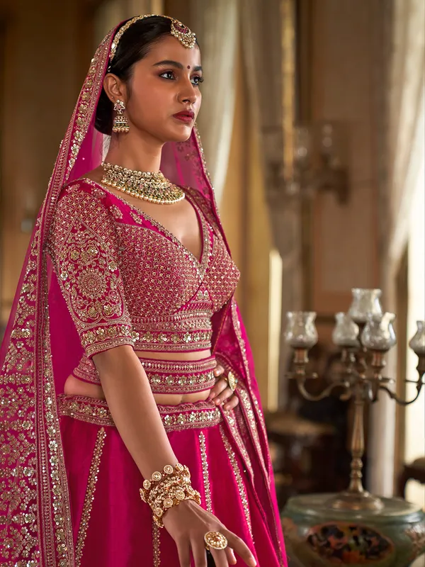 Rani pink silk bridal lehenga choli with beads work