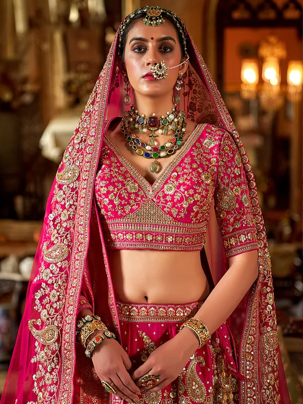 Rani pink silk bridal lehenga choli with rich beads and sequins work