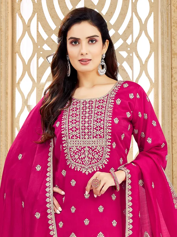 Rani pink silk salwar suit with resham elegance