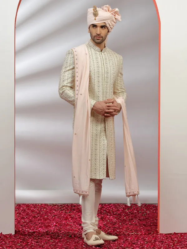 Raw silk fabric cream hue sherwani for groom
