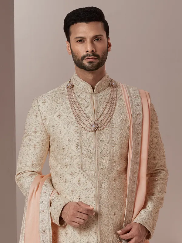 Raw silk fabric peach hue sherwani for groom