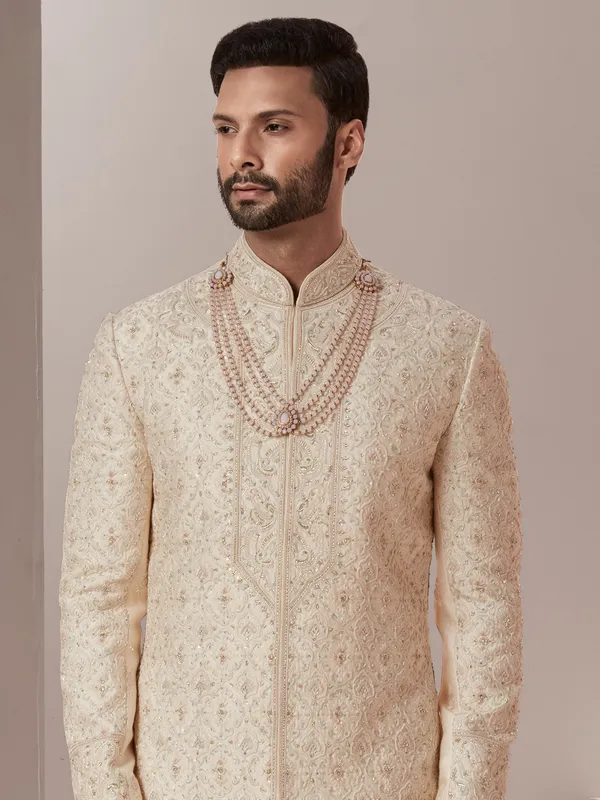 Raw silk fabric peach hue sherwani for groom