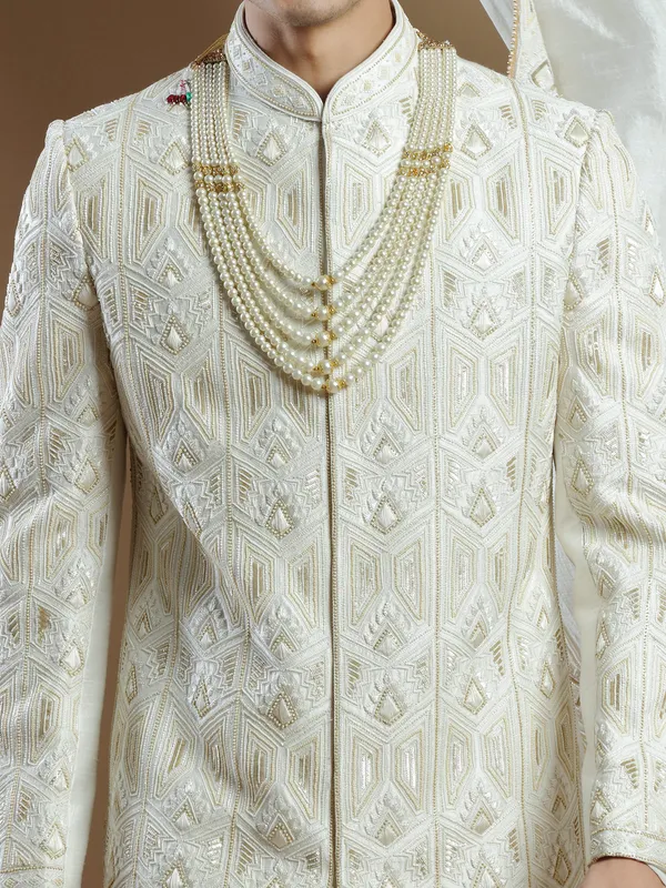 Raw silk groom sherwani in cream color