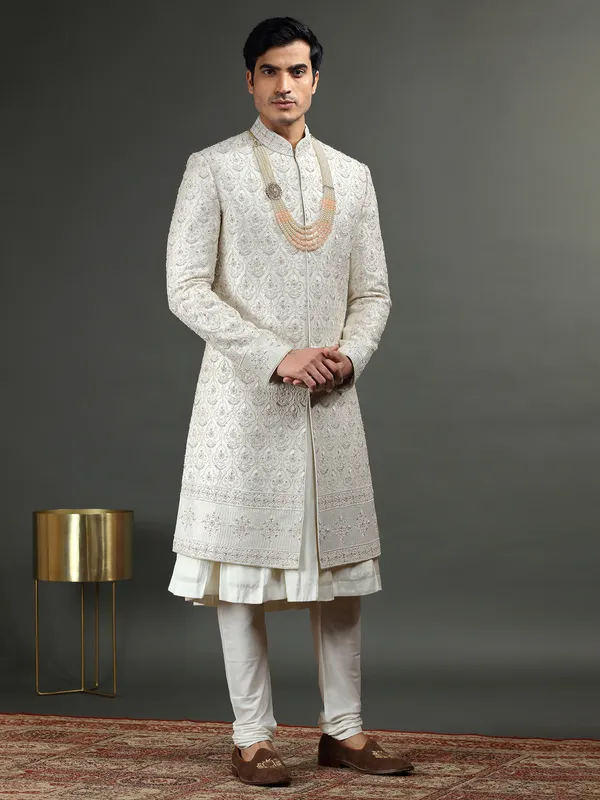 Raw silk groom sherwani in off white