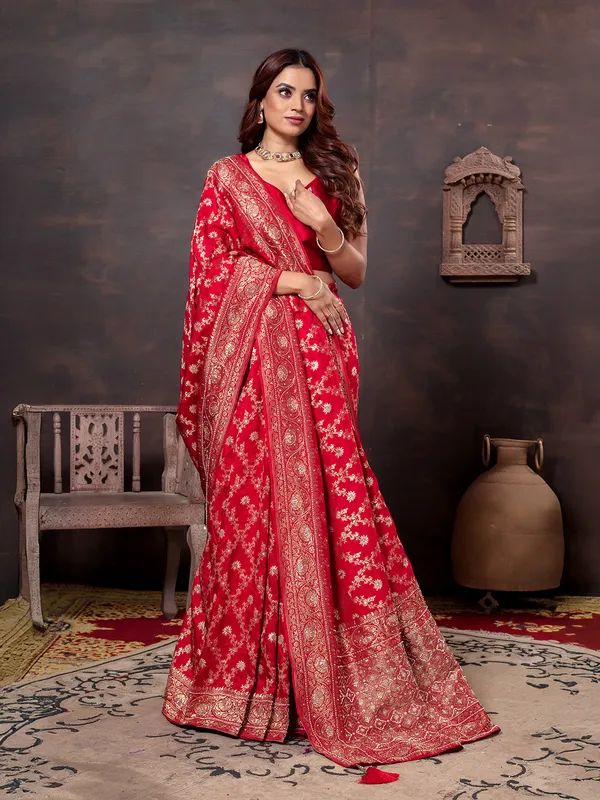 Red beads embellished saree in dola silk