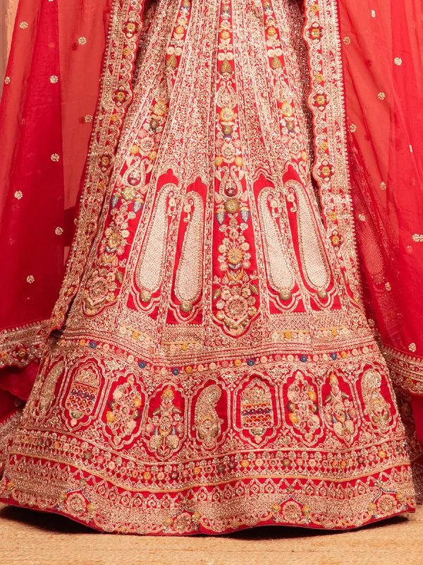 Red bridal lehenga choli with embellished blouse
