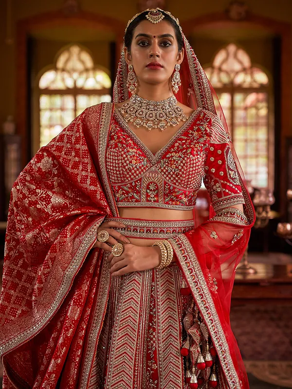 Red bridal silk lehenga choli with heavy embellishment