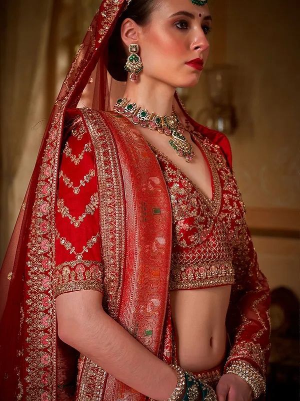 Red bridal silk lehenga choli with rich sequins embellishment